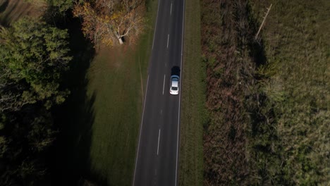 Aerial-Top-View-Tracking-Shot-of-Car-on-a-Straight-Road,-Argentina