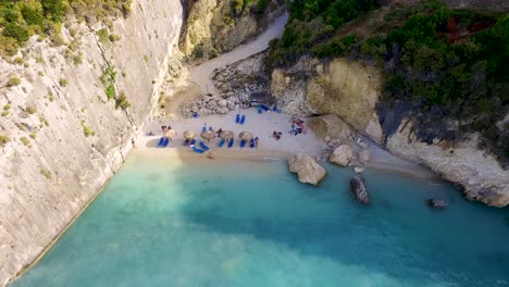 Xigia-beach-with-turquoise-waters-and-tourists,-zakynthos,-greece,-sunny-day,-aerial-view