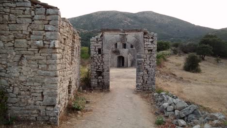 Aerial-of-Old-Perithia-Village-Revealing-Mount-Pantokrator,-Corfu,-Greece