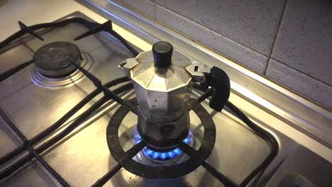 Closing-Lid-on-Moka-Pot-Over-Fire-on-stovetop