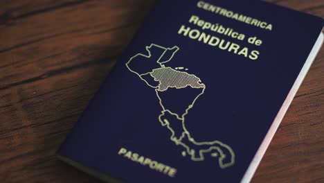 Close-up-of-official-Honduran-passport-document-on-a-wooden-surface