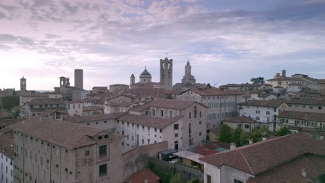 Ascensional-shot-of-the-medieval-village-of-Bergamo-Alta-with-the-building-of-the-old-"Sant'Agata"-prisons