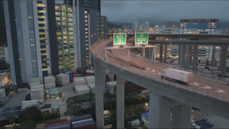 Elevated-logistics-road-on-top-of-Hong-Kong-container-operations-at-dusk