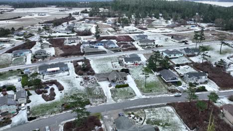 Drone-shot-of-snow-actively-falling-on-Washington-neighborhood