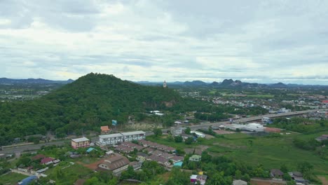 Magnificent-Views-from-an-Aerial-Drone-Over-Ratchaburi-Province-with-Khao-Kaen-Chan-on-a-Hilltop,-Thailand