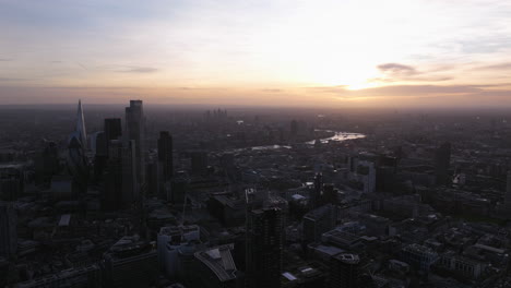Wide-circling-aerial-shot-of-central-London-at-dusk