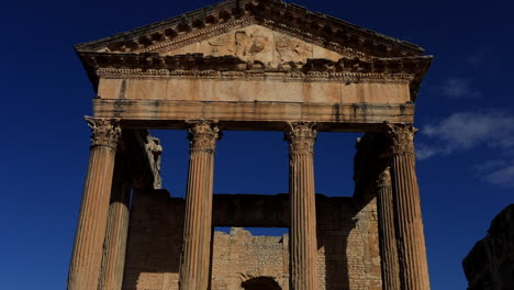Sunlit-Roman-columns-of-Dougga-against-a-clear-blue-sky