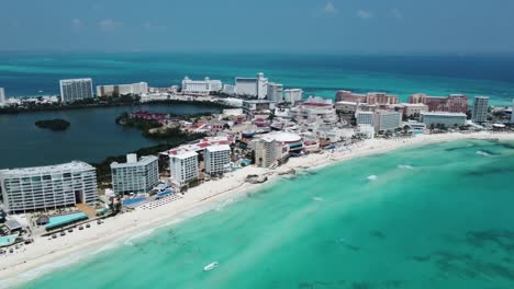 Cancun's-vibrant-coastline-with-turquoise-waters-and-bustling-resorts,-aerial-view