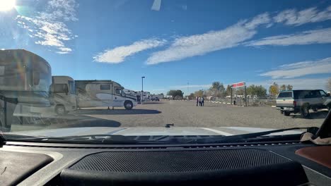 POV---Driving-thru-the-campground-with-horse-trailers,-near-the-dog-park-for-visitors