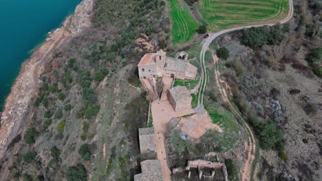 Flying-around-Rialb-tower-historical-building,-Lleida-in-Spain