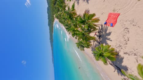 Color-contrast-of-Playa-Rincon-turquoise-ocean-waters-with-green-forest-in-Dominican-Republic