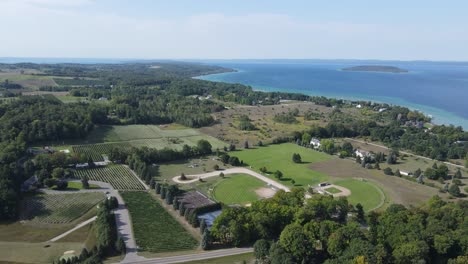 Old-Mission-Peninsula-with-farms-and-buildings,-aerial-drone-panoramic-view