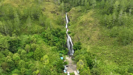 Aerial-shot-of-Efrata-Waterfall-near-Lake-Toba-surrounded-by-lush-greenery