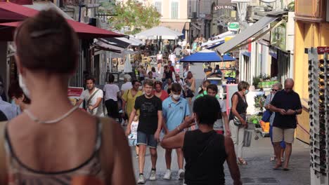 Close-static-shot-of-people-walking-in-Antibes-Old-Town-in-2020