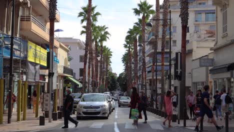 Groups-of-people-with-face-masks-cross-road-in-Antibes-in-2020