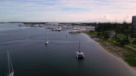 Right-to-left-aerial-views-over-the-Broadwater-and-marina-on-the-Gold-Coast,-Australia