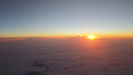High-Angle-View-of-Beautiful-Golden-Sunset-Above-Clouds