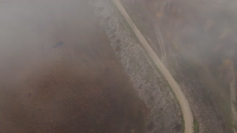 Aerial-flight-with-fog-over-the-Barrage-du-Planas-dam-in-Avignon,-France