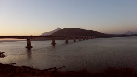 The-grand-Friendship-Bridge-spans-the-Mekong-River,-presenting-a-picturesque-vista
