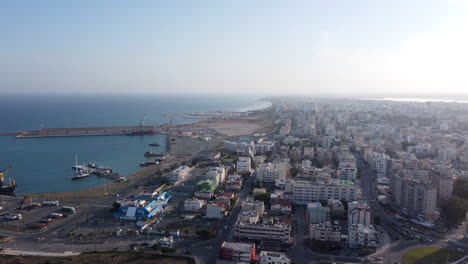 Aerial-flying-towards-Finikoudes-Beach,-Larnaca,-Cyprus