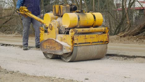 Hand-Operated-Mini-Road-Roller-Compactor-ground-gravel-slow-motion