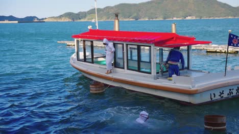 Three-Ama-divers-in-waters-of-Toba-bay