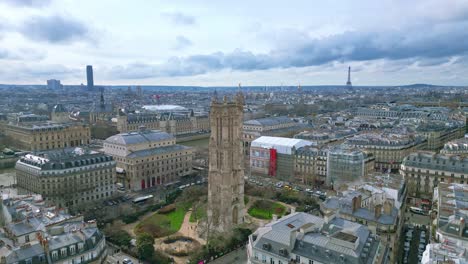 Saint-Jacques-Tower-and-square-with-Tour-Eiffel-in-background,-Boulevard-de-Sebastopol-at-Paris-in-France