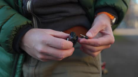 Mic-Phono-Jack-Being-Plugged-Into-Wireless-Mic-and-Being-Attached-On-Belt-Loop-On-Trousers