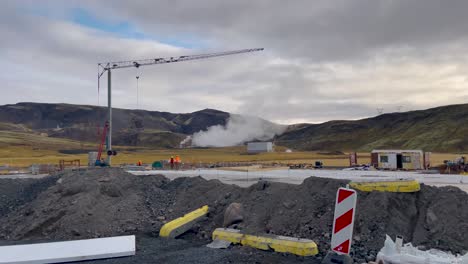 Industrial-construction-site-in-Iceland-with-crane-by-geothermal-plant