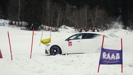 Extreme-handheld-shot-of-car-drive-through-dense-snow-layer-at-drift-event