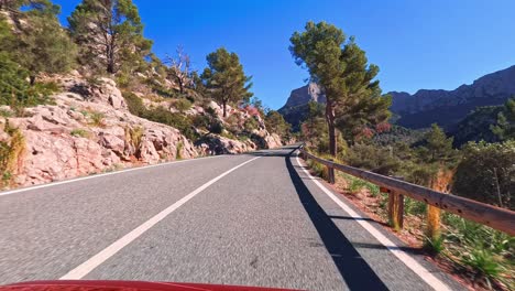 Sunny-POV-drive-on-Palma-de-Mallorca's-mountain-road