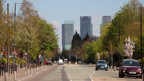 Skyscrapers-tower-above-Castlefield-in-Manchester-with-traffic-below-leaving-to-city-outskirts