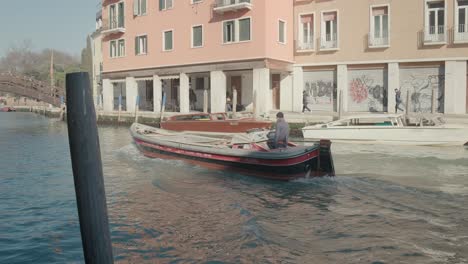 Vibrant-Venetian-Watercraft-Alongside-Canal