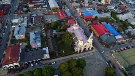 Aerial-Drone-fly-above-Patrimonial-Church-in-Castro-chiloé-neighborhood-patagonian-religious-building-and-urban-landscape,-travel-south-american-destination