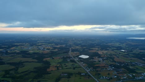 Impressive-view-from-above-of-a-natural-environment-in-Chiloé-at-sunset-with-clouds,-dramatic-and-desolate-landscape