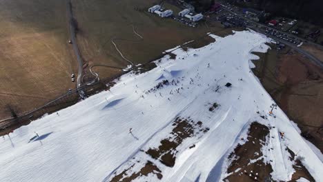 Aerial-view-over-Dolni-Morava-municipality-snowy-mountain-skiing-track-slope