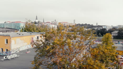 Aerial-pan-over-the-roof-of-the-Telliskivi-Loomelinnak-Cultural-Center-with-Artistic-Murals