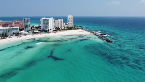 Cancun's-clear-turquoise-waters-and-white-beaches-with-resorts,-aerial-view