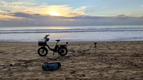 Static-shot-of-an-electric-bike-parked-at-Manhattan-Beach-at-sunset