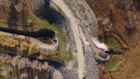 Autumn-Hues-over-Planas-Dam,-Avignon-Aerial-top-View