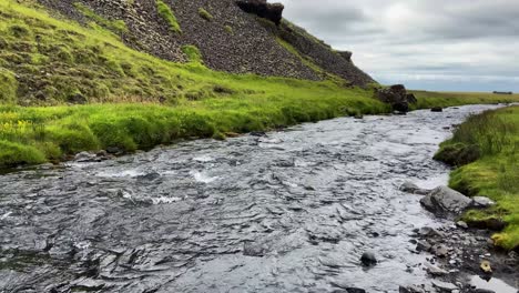 Wide-and-shallow-mountain-river-near-Skógar-region-in-Iceland