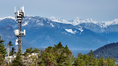 Communications-Tower-With-Snow-Mountains-In-The-Background-In-Horseshoe-Bay,-West-Vancouver,-Canada