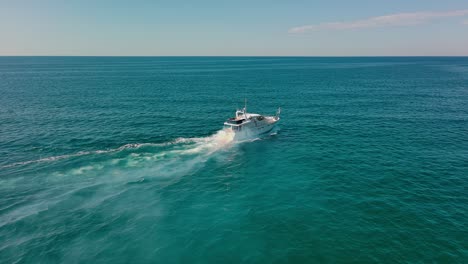 Luxury-yacht-navigating-on-blue-rippled-sea-surface