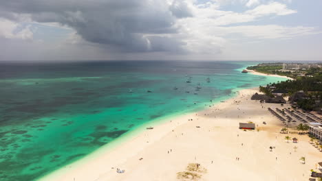 Top-view-of-sandy-beach-and-clear-green-water-timelapse-at-30-fps