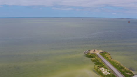 Dutch-Pier-on-Seaside-Village,-Forward-Drone-Shot,-4K