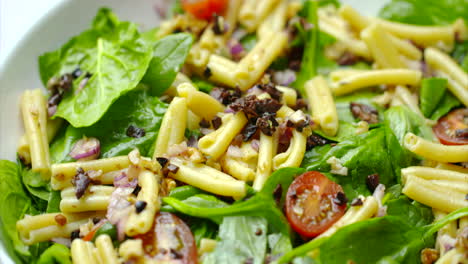 Pasta-salad-recipe-on-a-lunch-plate-rotating-in-close-up