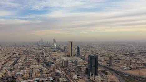 An-aerial-shot-of-Elegance-Tower-with-King-Fahd-Road-in-Riyadh,-Saudi-Arabia