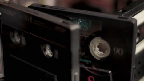 Close-Up-of-Different-Brands-and-Types-of-Audio-Cassette-Tapes-Spinning-in-Circe