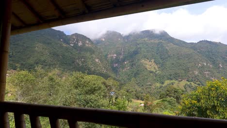 frontal-dolly-of-a-distant-view-of-La-Chorrera-waterfall,-located-in-the-municipality-of-Choachí,-Colombia