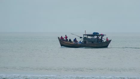 Telephoto-fishermen-fishing-with-trawler-boat-in-the-indian-ocean,-bay-of-bengal